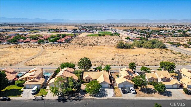 2908 Owens Way, Rosamond, CA 93560 - aerial view of residential area featuring a mountainous background and a desert landscape