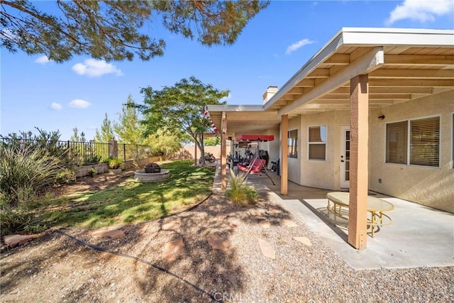 2908 Owens Way, Rosamond, CA 93560 - fenced backyard featuring an outdoor fire pit and a patio