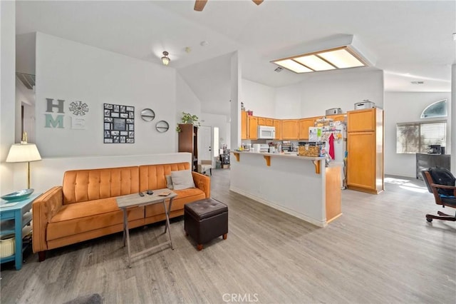 2908 Owens Way, Rosamond, CA 93560 - living area featuring light wood finished floors and high vaulted ceiling