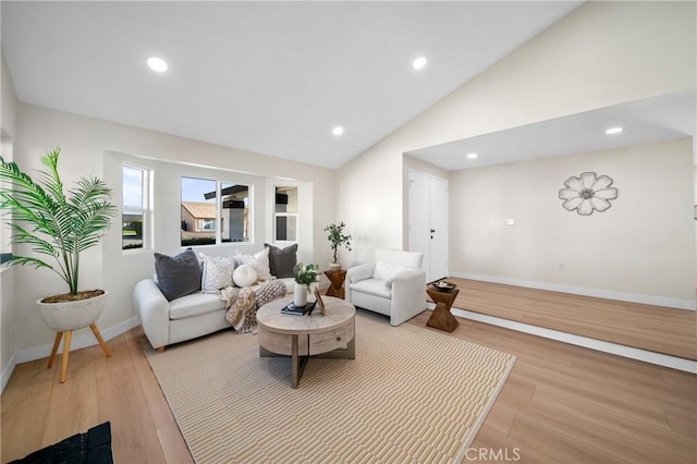 15604 Sharonhill Dr, Whittier, CA 90604 - living room with light wood-type flooring, vaulted ceiling, and recessed lighting