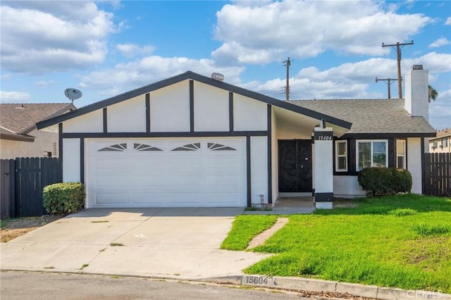 15604 Sharonhill Dr, Whittier, CA 90604 - view of front of property featuring an attached garage, driveway, stucco siding, a chimney, and a shingled roof