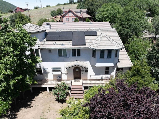 34667 Navajo Rd, Julian, CA 92036 - view of front of property featuring stucco siding, stairs, solar panels, and a wooden deck