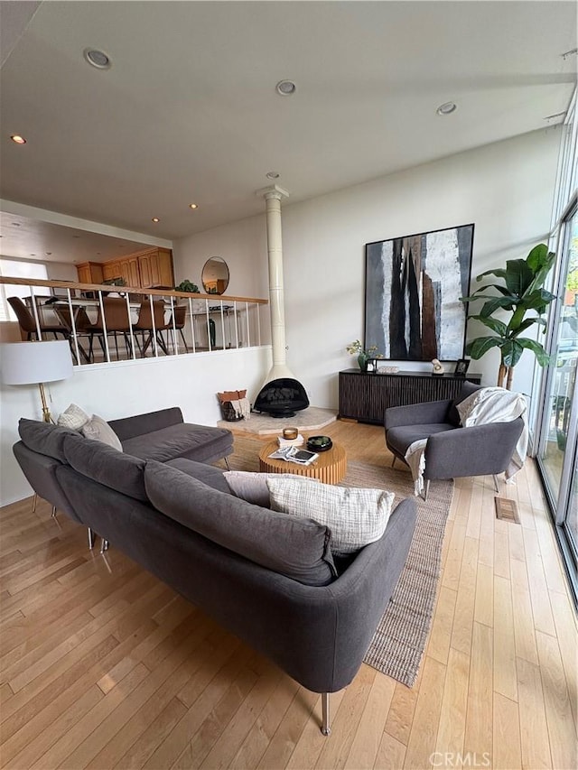 4280 W Kling St, Burbank, CA 91505 - living room featuring light wood-type flooring, a wood stove, and recessed lighting