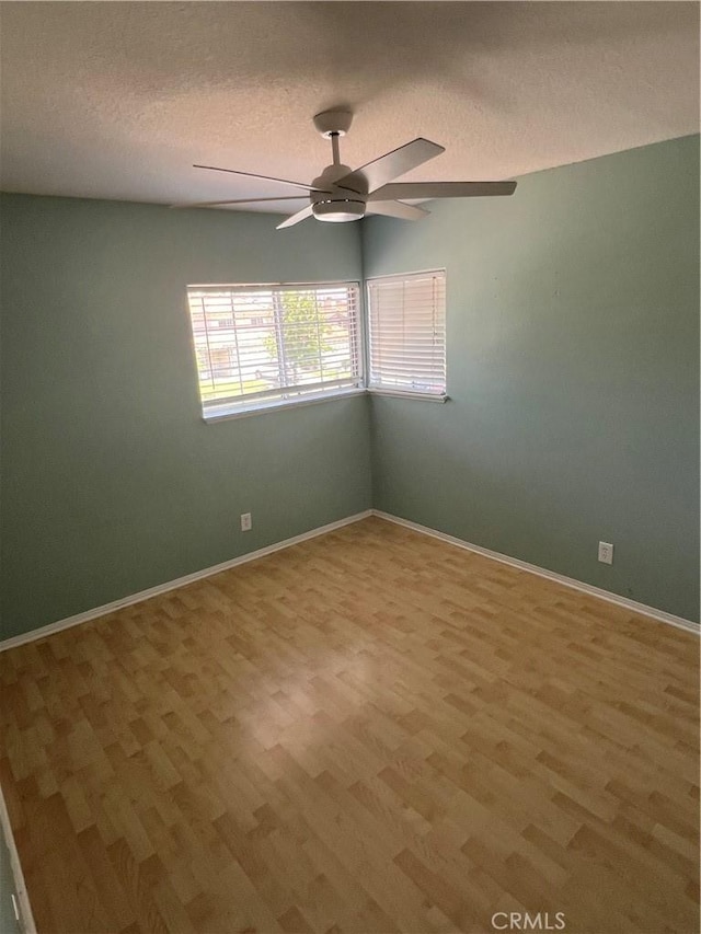 766 Lassen Dr, Corona, CA 92879 - empty room featuring light wood finished floors, ceiling fan, and a textured ceiling