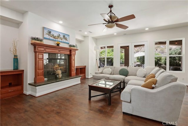 26677 Avenida Del Oro, Temecula, CA 92590 - living area with a ceiling fan, dark wood-style flooring, a glass covered fireplace, and recessed lighting