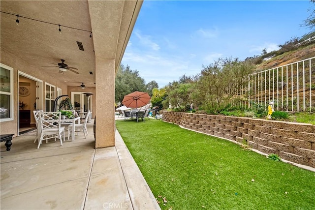 26677 Avenida Del Oro, Temecula, CA 92590 - view of yard featuring a ceiling fan, a patio, and outdoor dining space