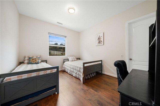 26677 Avenida Del Oro, Temecula, CA 92590 - bedroom with dark wood-style flooring and baseboards