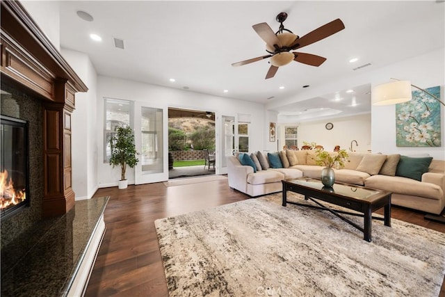 26677 Avenida Del Oro, Temecula, CA 92590 - living room with a fireplace, recessed lighting, dark wood-style flooring, and ceiling fan