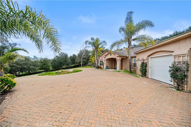 26677 Avenida Del Oro, Temecula, CA 92590 - view of front facade with decorative driveway, stucco siding, and a garage