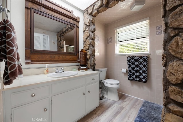 1924 E Rancho Culebra Dr, Covina, CA 91724 - bathroom featuring vanity, wood finished floors, and tile walls