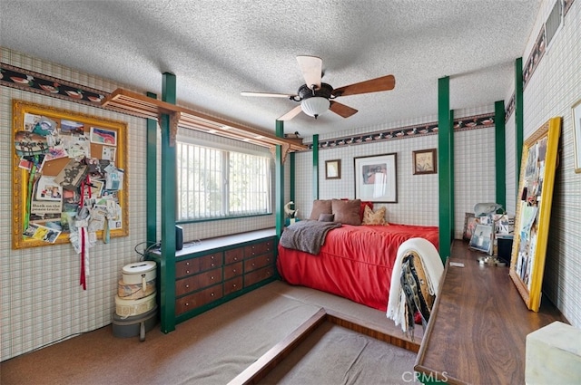 1924 E Rancho Culebra Dr, Covina, CA 91724 - bedroom with wallpapered walls, a textured ceiling, a ceiling fan, and wood finished floors