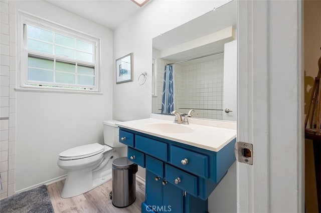 1924 E Rancho Culebra Dr, Covina, CA 91724 - full bathroom with wood finished floors, vanity, and a shower with curtain