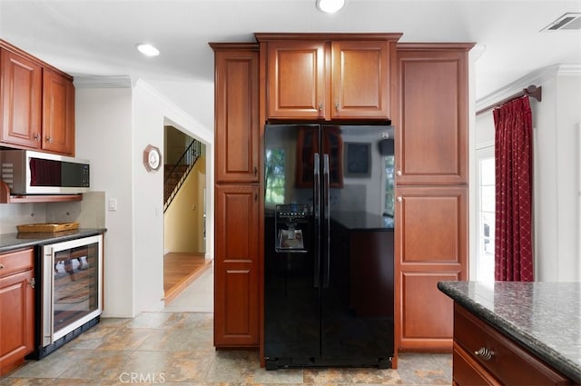 1924 E Rancho Culebra Dr, Covina, CA 91724 - kitchen featuring black refrigerator with ice dispenser, wine cooler, stainless steel microwave, crown molding, and decorative backsplash