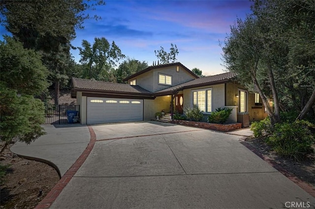 1924 E Rancho Culebra Dr, Covina, CA 91724 - traditional home featuring concrete driveway, stucco siding, a garage, and a tile roof