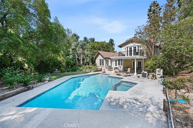 1924 E Rancho Culebra Dr, Covina, CA 91724 - view of pool featuring a patio, a pool with connected hot tub, french doors, and view of scattered trees