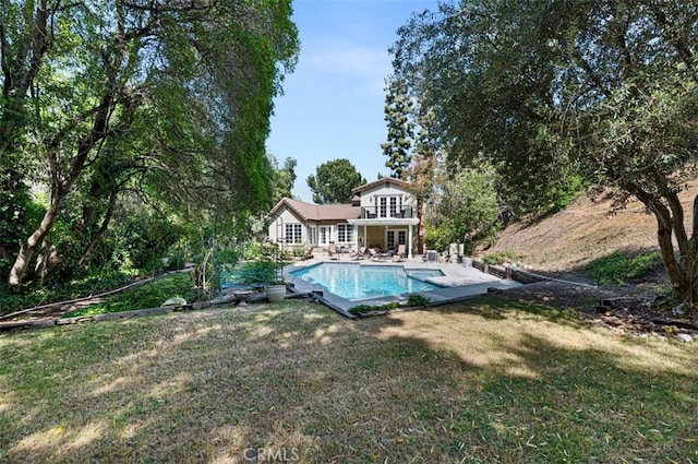 1924 E Rancho Culebra Dr, Covina, CA 91724 - back of house featuring french doors, a lawn, a patio area, and an outdoor pool