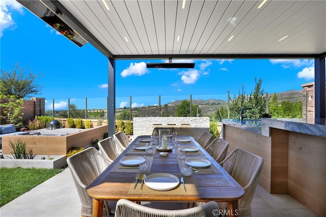 109 Ritual, Irvine, CA 92618 - view of patio / terrace featuring outdoor dining space and a mountain view