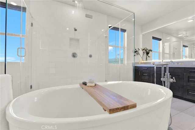 109 Ritual, Irvine, CA 92618 - bathroom featuring a freestanding bath, vanity, a shower stall, and healthy amount of natural light