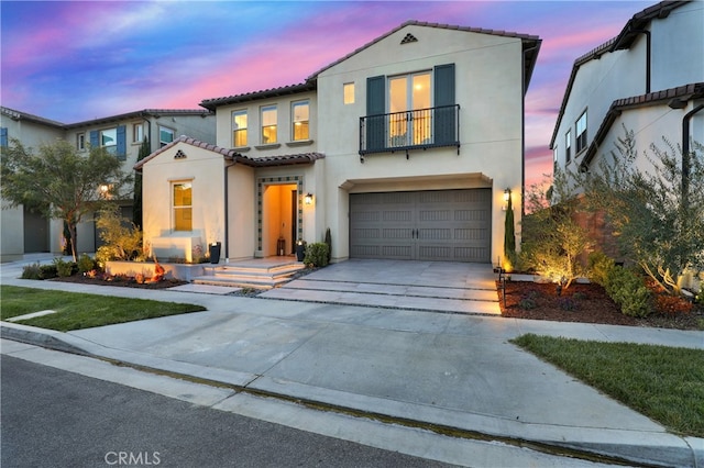 109 Ritual, Irvine, CA 92618 - mediterranean / spanish house with a balcony, stucco siding, a tile roof, an attached garage, and driveway