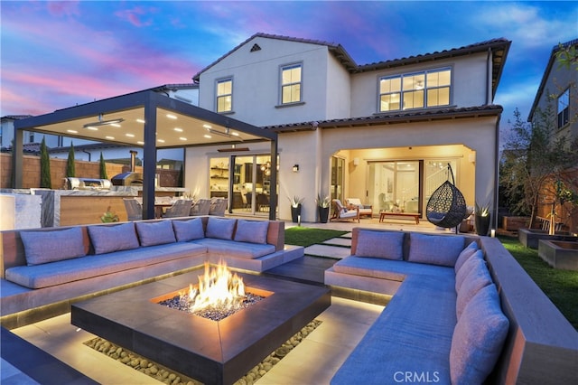 109 Ritual, Irvine, CA 92618 - rear view of property with an outdoor living space with a fire pit, a patio area, and a tile roof