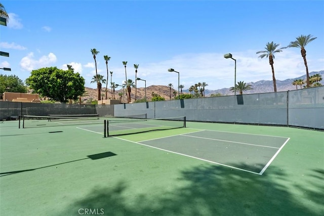 4881 S Winners Cir Unit A, Palm Springs, CA 92264 - view of tennis court with a mountain view and community basketball court