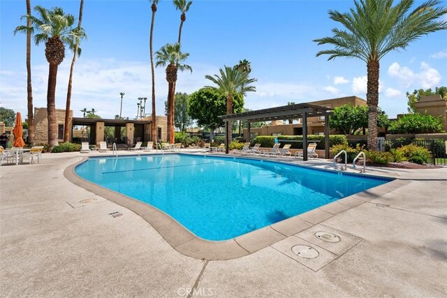 4881 S Winners Cir Unit A, Palm Springs, CA 92264 - community pool with a pergola and a patio