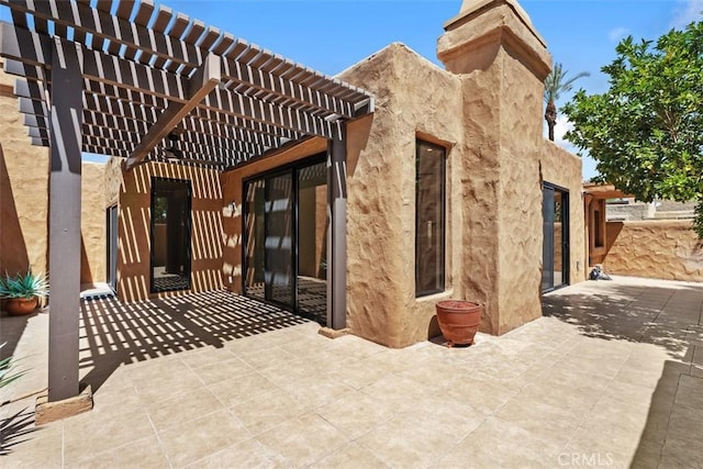 4881 S Winners Cir Unit A, Palm Springs, CA 92264 - view of patio featuring a pergola