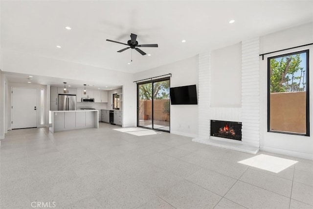 4881 S Winners Cir Unit A, Palm Springs, CA 92264 - unfurnished living room with recessed lighting, a brick fireplace, and ceiling fan