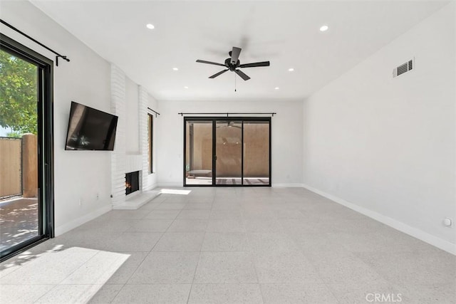 4881 S Winners Cir Unit A, Palm Springs, CA 92264 - unfurnished living room with a fireplace, a ceiling fan, and recessed lighting