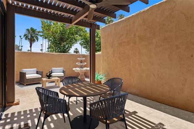 4881 S Winners Cir Unit A, Palm Springs, CA 92264 - view of patio / terrace featuring a pergola, outdoor dining area, and a ceiling fan