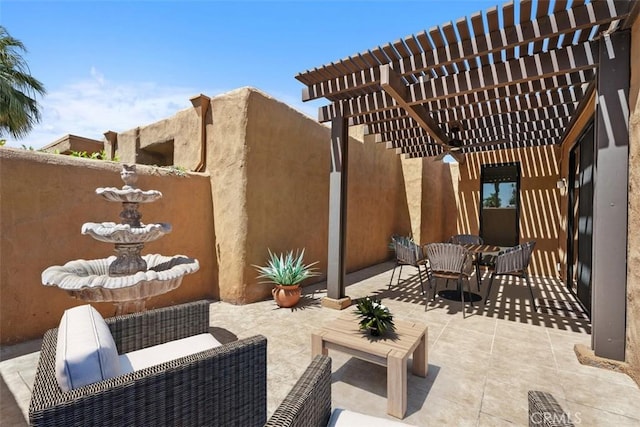 4881 S Winners Cir Unit A, Palm Springs, CA 92264 - view of patio featuring outdoor dining space and a pergola