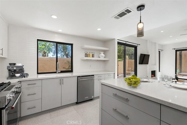 4881 S Winners Cir Unit A, Palm Springs, CA 92264 - kitchen with stainless steel appliances, gray cabinetry, recessed lighting, decorative light fixtures, and open shelves