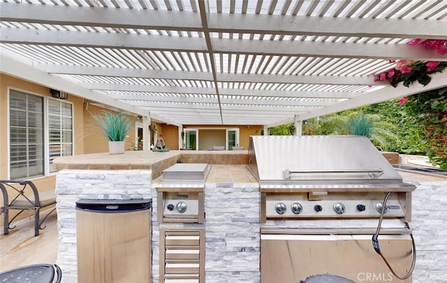 16671 Cedar Cir, Fountain Valley, CA 92708 - view of patio / terrace featuring exterior kitchen and a pergola