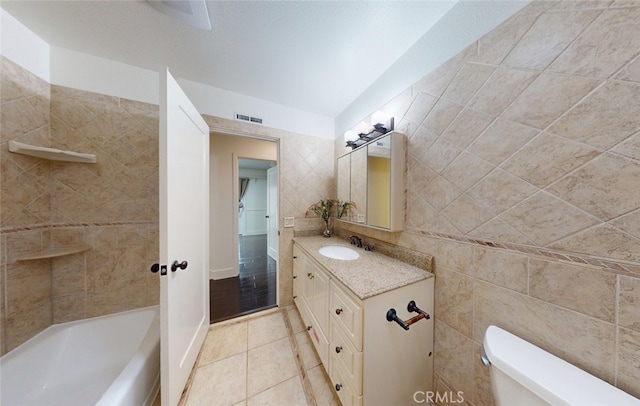 16671 Cedar Cir, Fountain Valley, CA 92708 - full bathroom featuring vanity, tile patterned floors, and tile walls