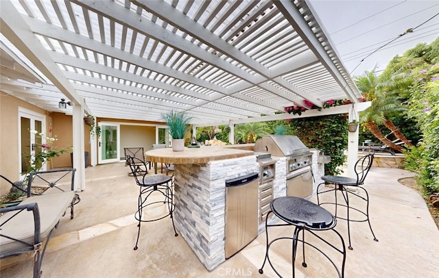 16671 Cedar Cir, Fountain Valley, CA 92708 - view of patio featuring an outdoor kitchen and a pergola