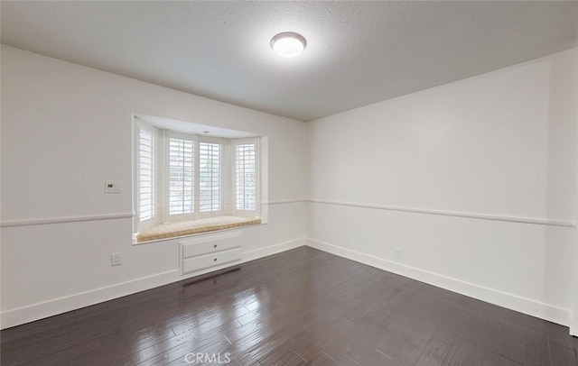 16671 Cedar Cir, Fountain Valley, CA 92708 - spare room with dark wood-style flooring and a textured ceiling