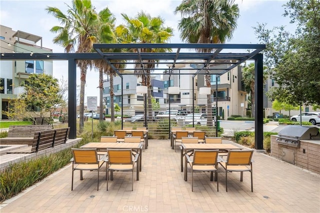 687 W 17th St, Costa Mesa, CA 92627 - view of home's community with outdoor dining area, a patio, and an outdoor kitchen