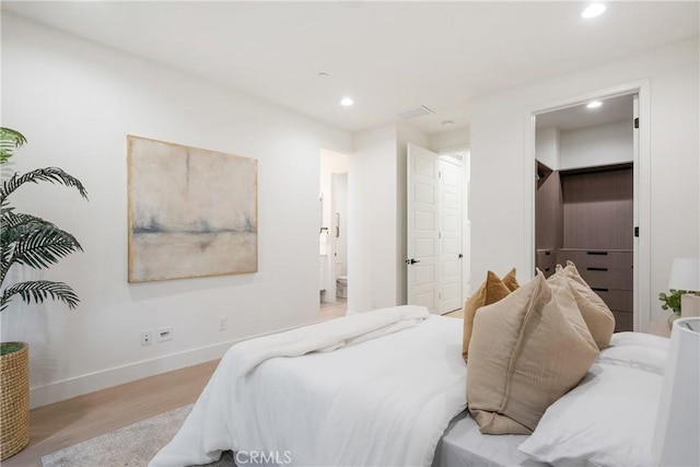 687 W 17th St, Costa Mesa, CA 92627 - bedroom with recessed lighting, light wood finished floors, and a spacious closet
