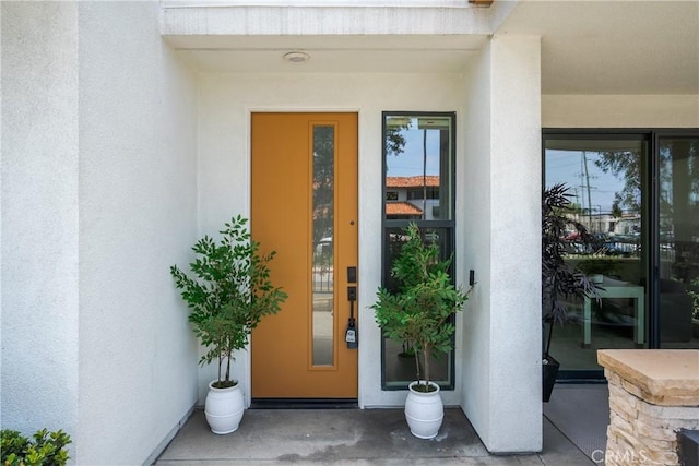 687 W 17th St, Costa Mesa, CA 92627 - doorway to property with stucco siding