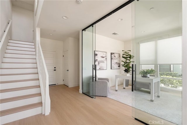 687 W 17th St, Costa Mesa, CA 92627 - stairway featuring wood finished floors and recessed lighting
