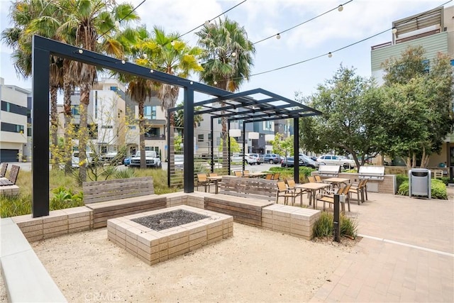 687 W 17th St, Costa Mesa, CA 92627 - view of patio with a fire pit