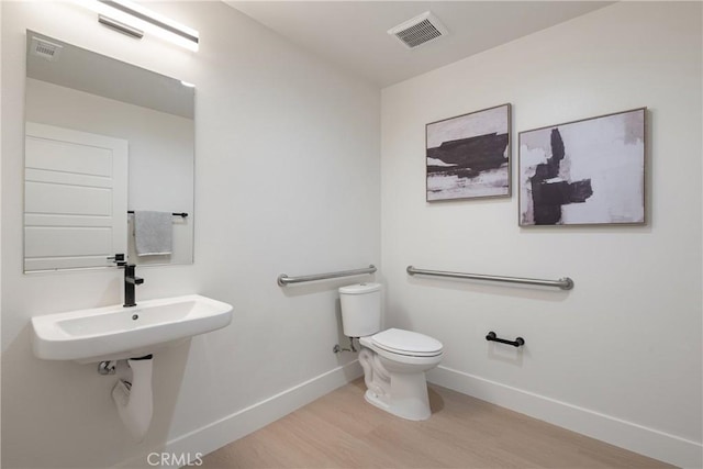 687 W 17th St, Costa Mesa, CA 92627 - half bath featuring wood finished floors and baseboards