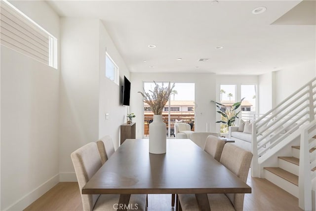 687 W 17th St, Costa Mesa, CA 92627 - dining space with light wood finished floors, stairway, and recessed lighting