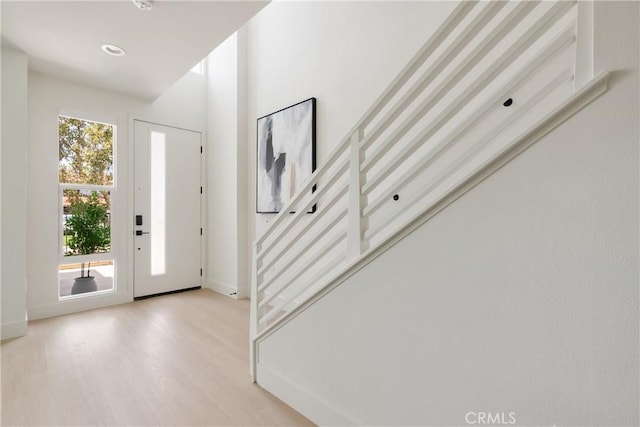 687 W 17th St, Costa Mesa, CA 92627 - foyer featuring light wood finished floors and stairway