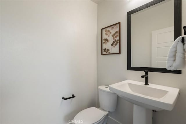 687 W 17th St, Costa Mesa, CA 92627 - half bath featuring toilet and a sink