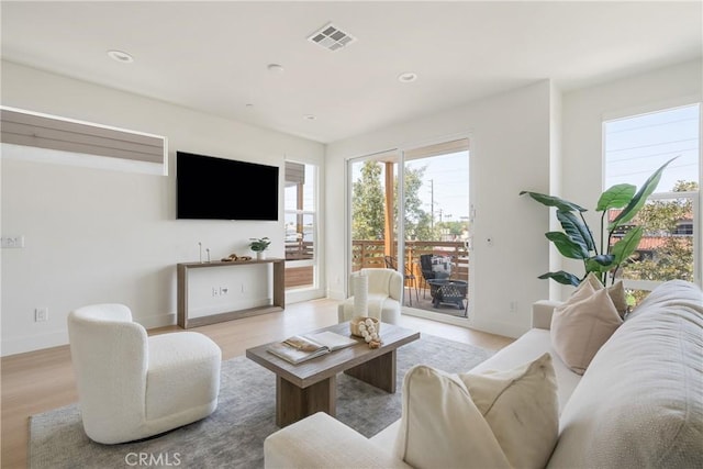 687 W 17th St, Costa Mesa, CA 92627 - living room featuring light wood-style floors and recessed lighting