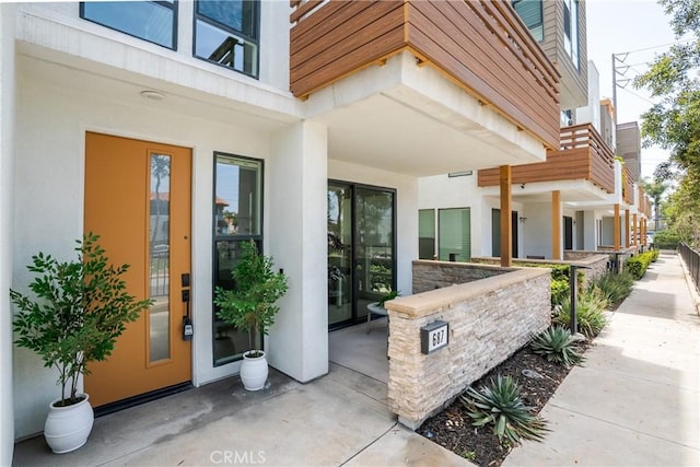687 W 17th St, Costa Mesa, CA 92627 - doorway to property with stucco siding