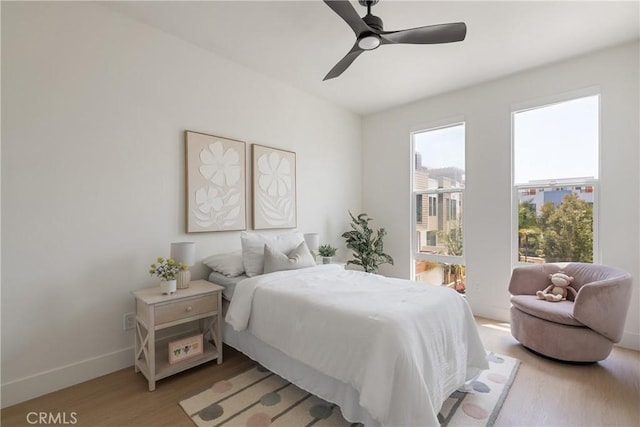 687 W 17th St, Costa Mesa, CA 92627 - bedroom with light wood-style floors and a ceiling fan