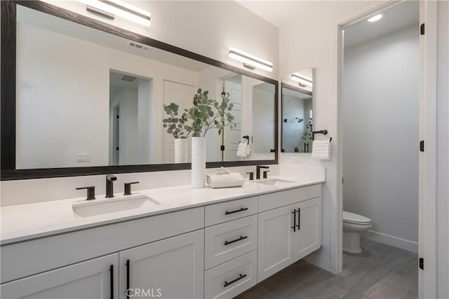 687 W 17th St, Costa Mesa, CA 92627 - bathroom featuring double vanity and toilet