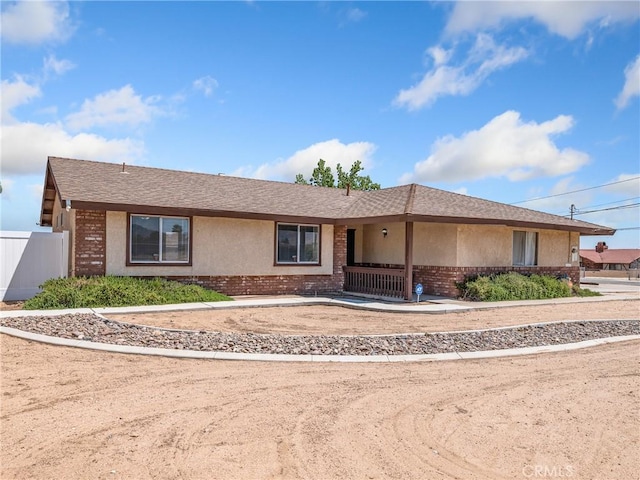 17702 Hinton St, Hesperia, CA 92345 - ranch-style house featuring brick siding, roof with shingles, and stucco siding